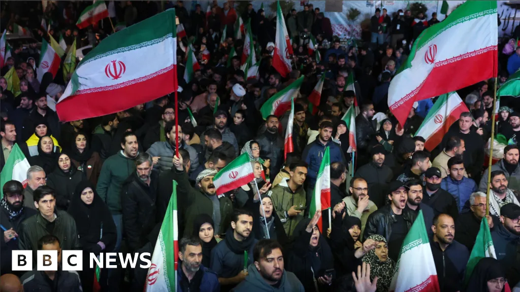 Iran celebrates ceasefire with US as Tehran streets fill with demonstrators