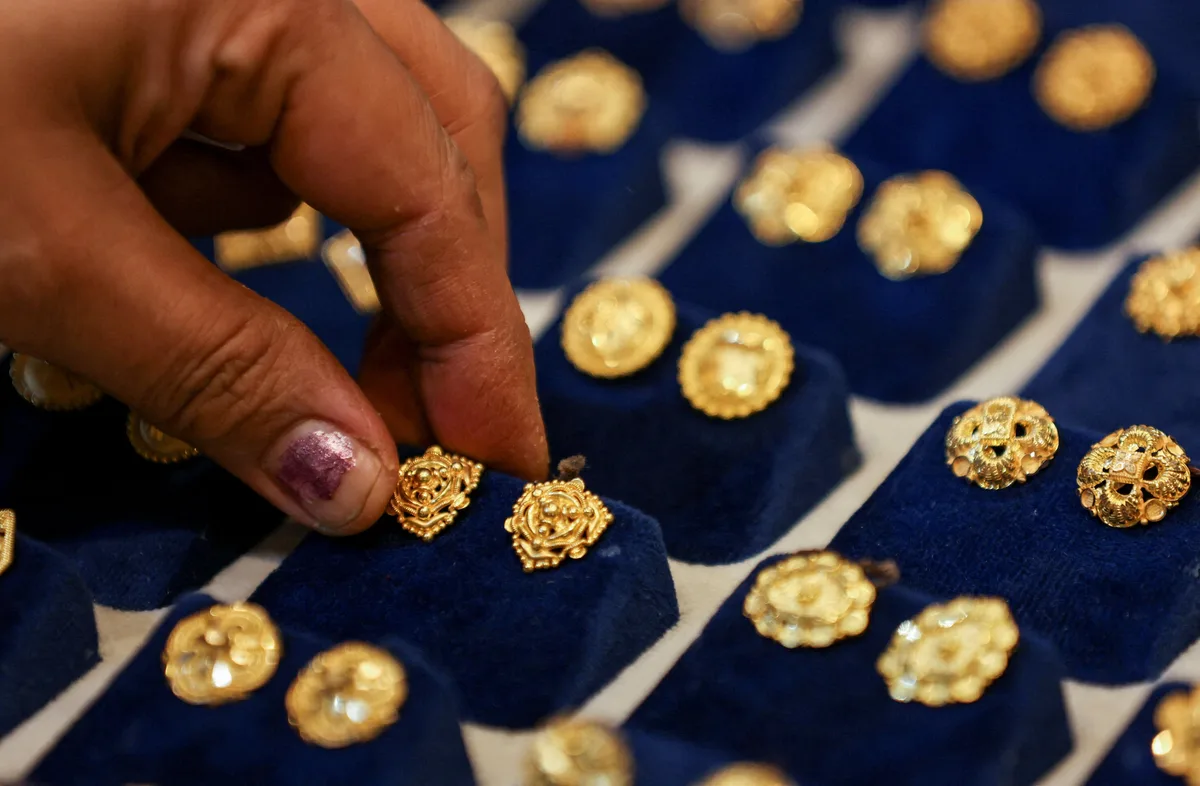 Gold ticks up on softer dollar after Iran peace proposal report - Reuters